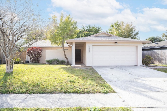 ranch-style home with a front lawn and a garage