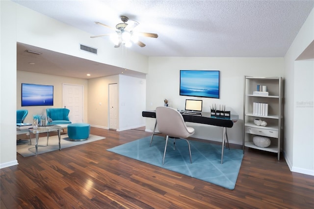 office space featuring ceiling fan, dark hardwood / wood-style flooring, and a textured ceiling