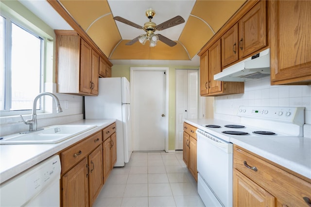 kitchen featuring tasteful backsplash, white appliances, ceiling fan, sink, and light tile patterned floors