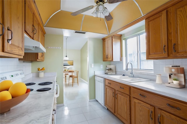 kitchen featuring ceiling fan, white appliances, sink, and tasteful backsplash