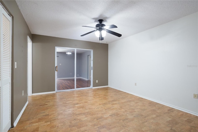 unfurnished bedroom with light wood-type flooring, a textured ceiling, and ceiling fan