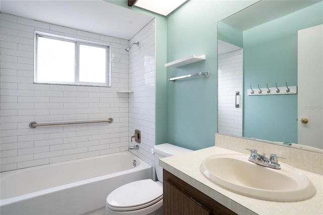 full bathroom with vanity, tiled shower / bath combo, and toilet