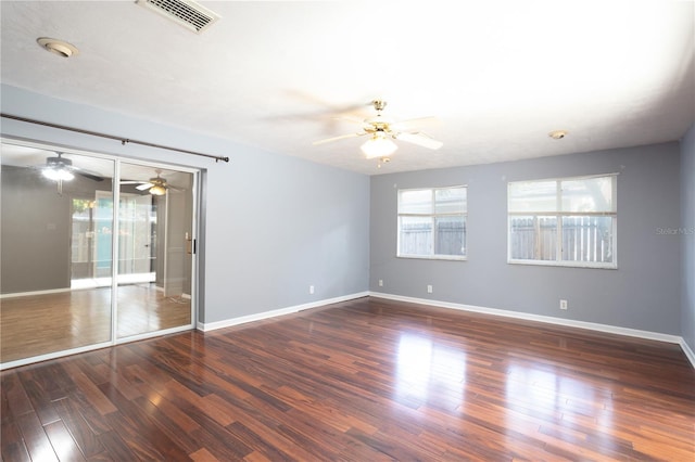 spare room featuring dark wood-type flooring