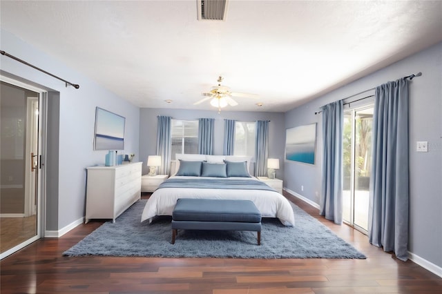 bedroom with ceiling fan, dark wood-type flooring, and access to outside