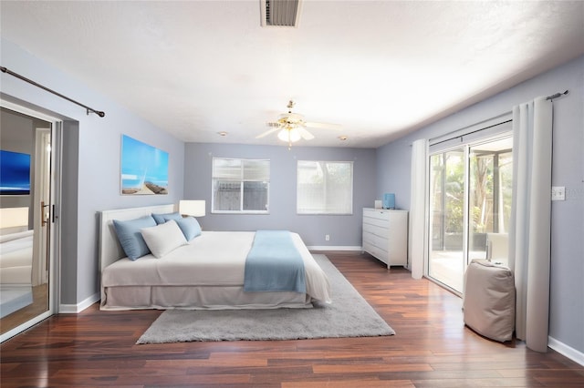 bedroom with dark hardwood / wood-style floors, ceiling fan, and access to exterior