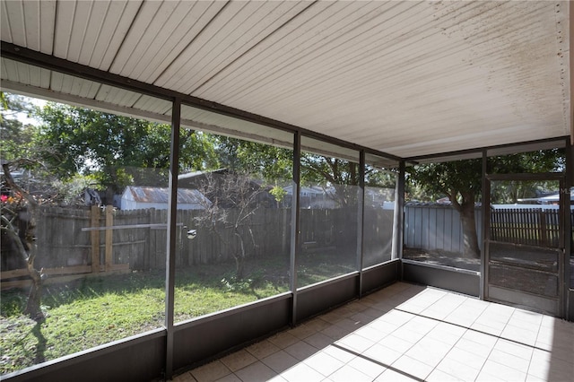 unfurnished sunroom featuring wooden ceiling and a wealth of natural light