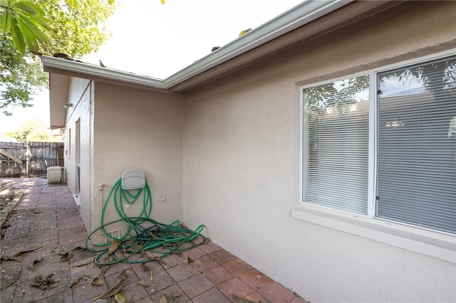 view of side of property with a patio