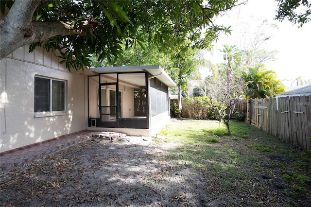 view of yard with a sunroom