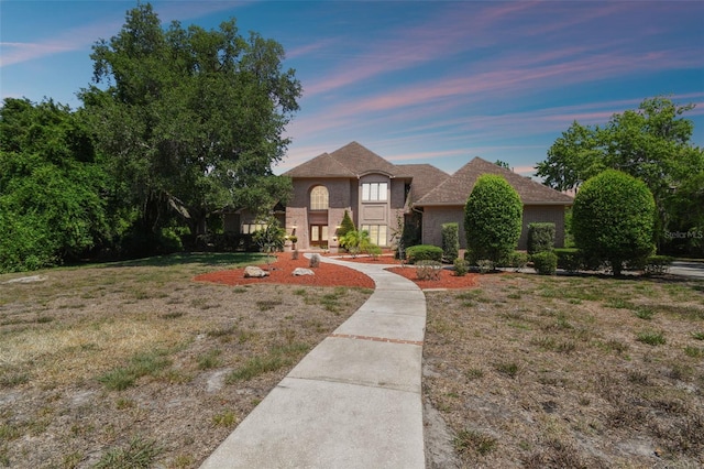 view of front of property with a lawn