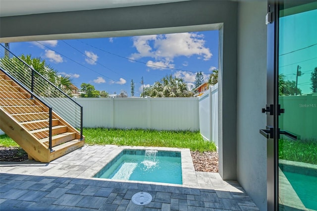 view of swimming pool with a patio