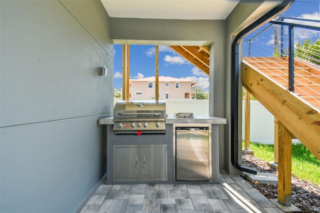 exterior space featuring stainless steel refrigerator and a wealth of natural light