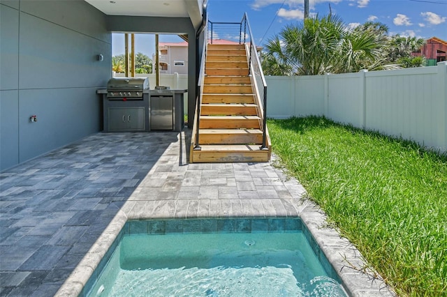 exterior space featuring an outdoor kitchen and grilling area