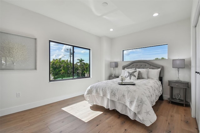 bedroom with hardwood / wood-style floors