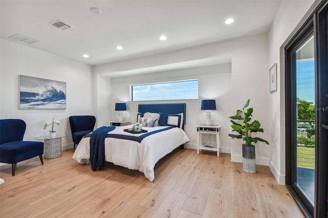 bedroom with light hardwood / wood-style floors