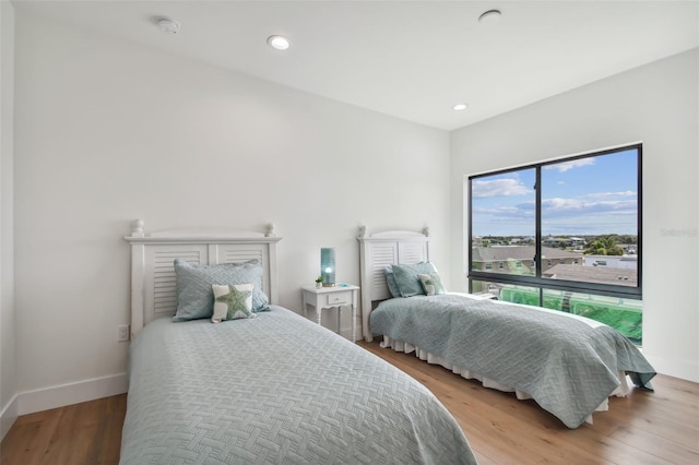 bedroom with light hardwood / wood-style flooring