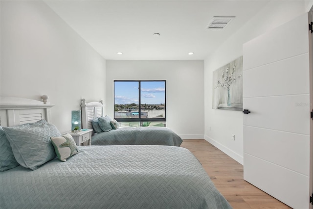 bedroom with light hardwood / wood-style flooring