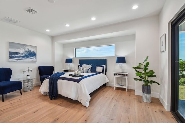 bedroom with light hardwood / wood-style flooring