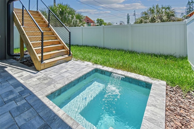 view of swimming pool featuring a patio area and pool water feature