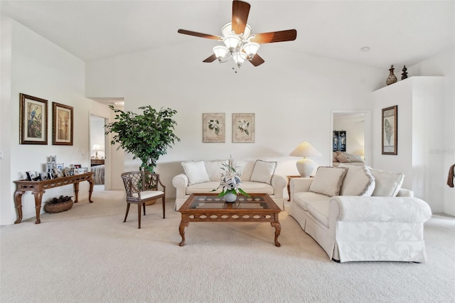 living room featuring light colored carpet, high vaulted ceiling, and ceiling fan