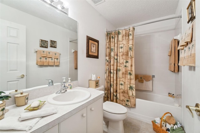 full bathroom with vanity, tile patterned floors, toilet, a textured ceiling, and shower / tub combo