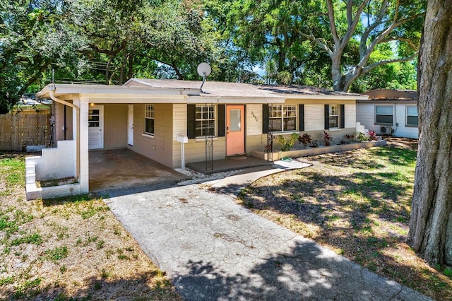 single story home featuring a carport