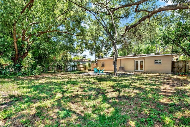 view of yard with french doors