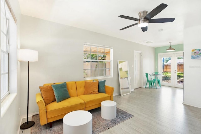 6490 34th Ave N, Saint Petersburg, FL 33710 - living room featuring french doors, ceiling fan, and hardwood / wood-style flooring