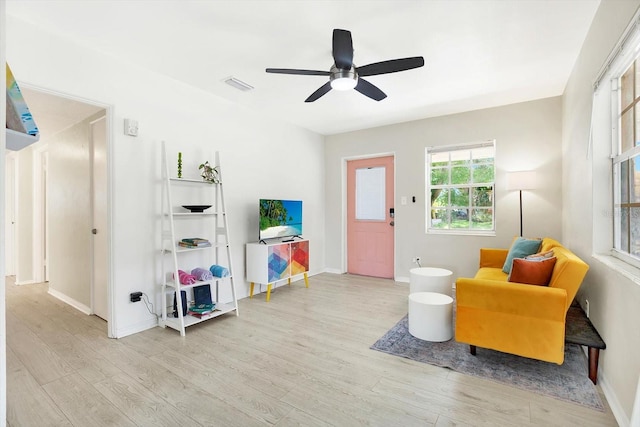6490 34th Ave N, Saint Petersburg, FL 33710 - living area with ceiling fan and light hardwood / wood-style flooring