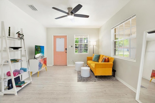 6490 34th Ave N, Saint Petersburg, FL 33710 - living area featuring ceiling fan and light hardwood / wood-style flooring