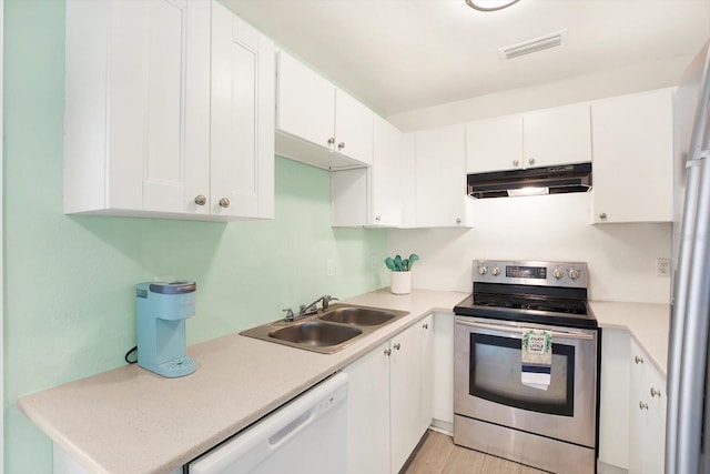 6490 34th Ave N, Saint Petersburg, FL 33710 - kitchen featuring white cabinetry, sink, stainless steel range with electric cooktop, and white dishwasher