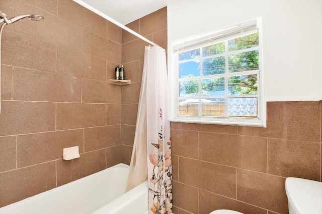 6490 34th Ave N, Saint Petersburg, FL 33710 - bathroom featuring tile walls, shower / bathtub combination with curtain, and toilet