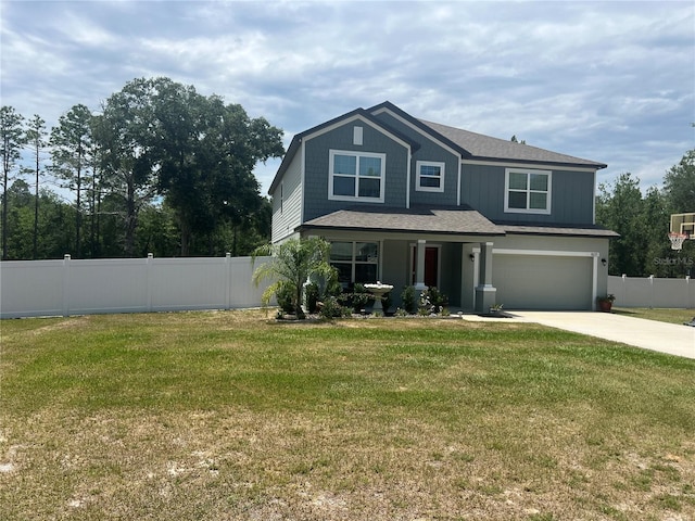 view of front of property featuring a front yard and a garage