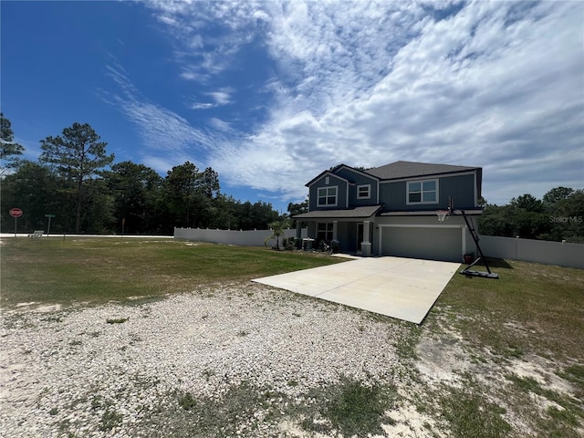 view of front of house with a front yard and a garage