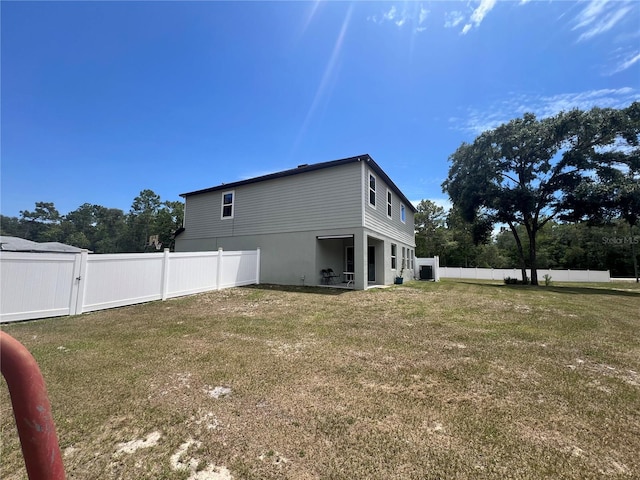 view of property exterior featuring a lawn