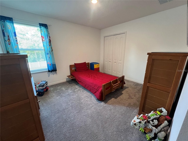 carpeted bedroom featuring a closet