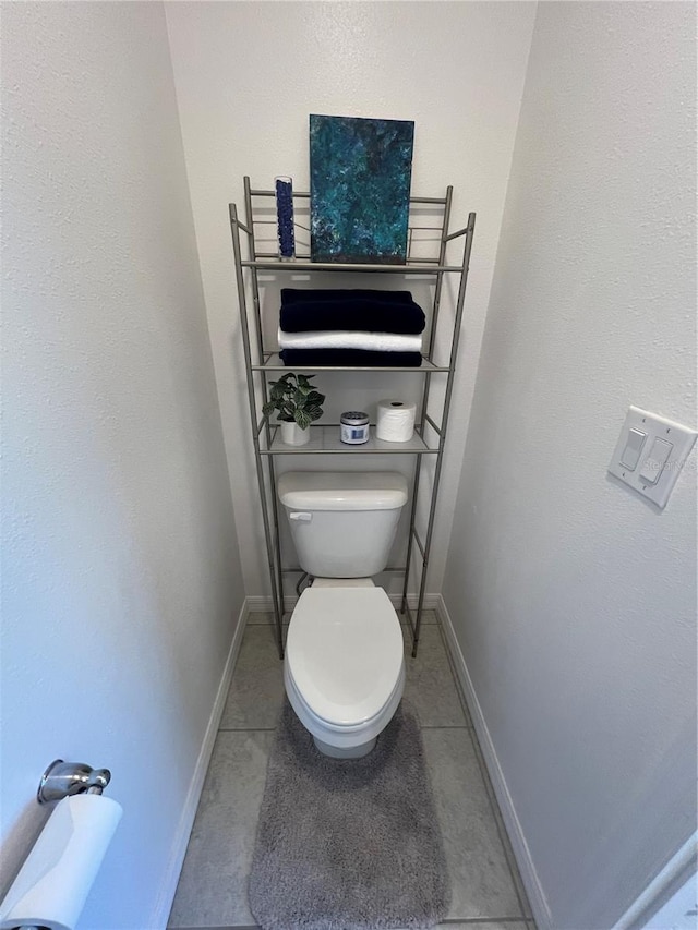 bathroom featuring tile patterned floors and toilet