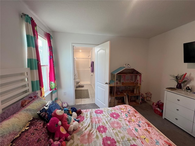 carpeted bedroom featuring ensuite bathroom