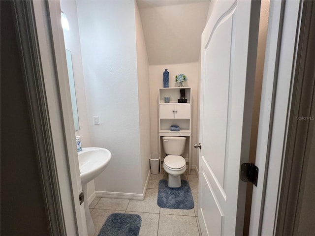 bathroom with tile patterned flooring and toilet