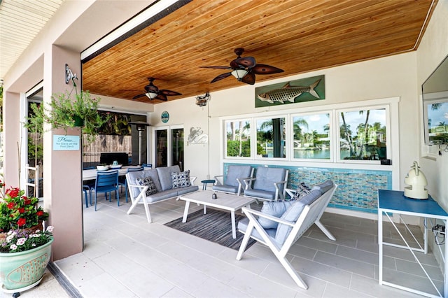 view of patio featuring an outdoor living space and ceiling fan