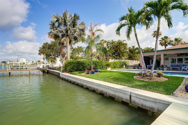 dock area featuring a water view and a yard