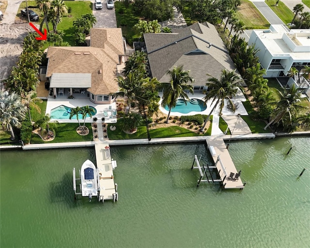 birds eye view of property featuring a water view