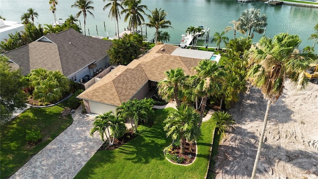 birds eye view of property with a water view