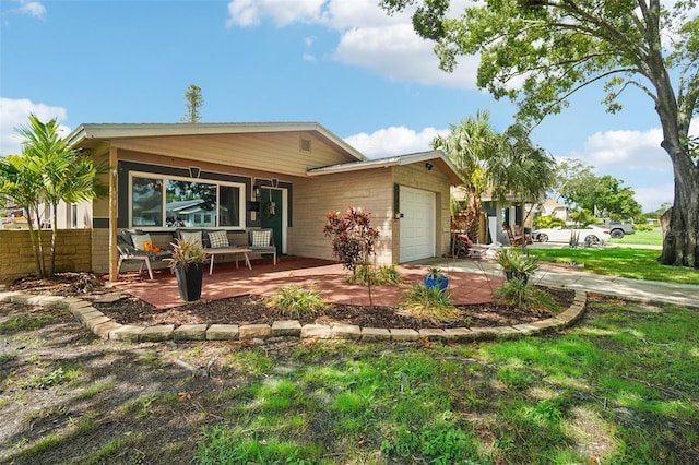 view of front of home with a garage and a porch