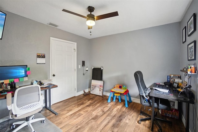 office space with wood-type flooring and ceiling fan