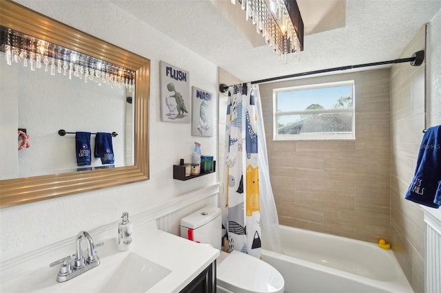 full bathroom with vanity, a textured ceiling, toilet, and shower / tub combo with curtain