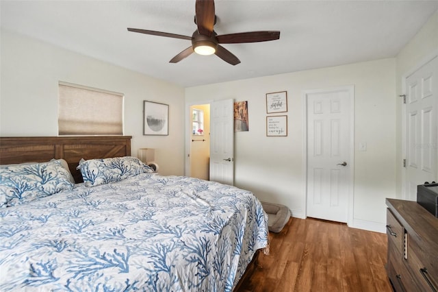 bedroom featuring ceiling fan and dark hardwood / wood-style flooring