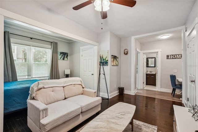 living room with dark hardwood / wood-style floors and ceiling fan