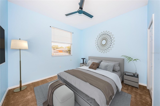 carpeted bedroom with baseboards and a ceiling fan