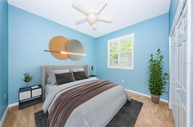 bedroom with carpet floors, ceiling fan, and baseboards