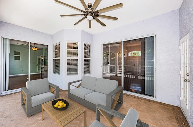 view of patio featuring ceiling fan and outdoor lounge area